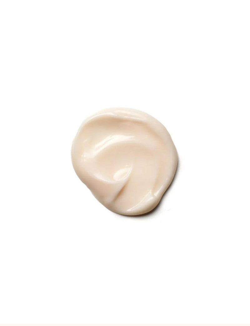Beige cream droplet of Moroccanoil moisture repair conditioner on a white background