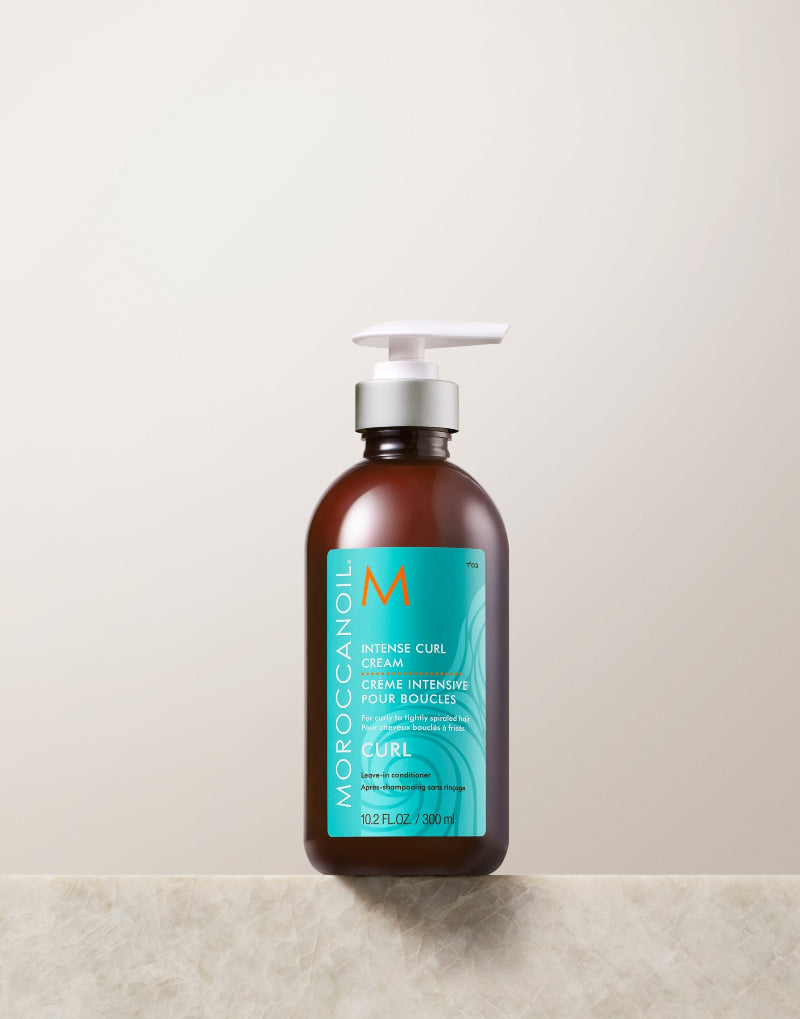 Moroccanoil bottle of hair cream for curly hair on a light background