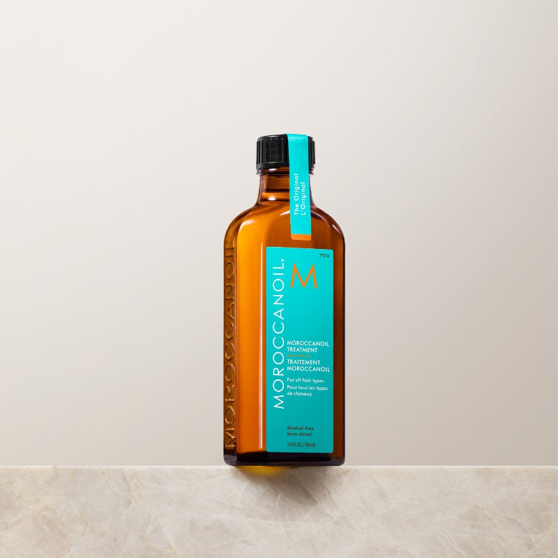 Moroccanoil bottle on a light gray background