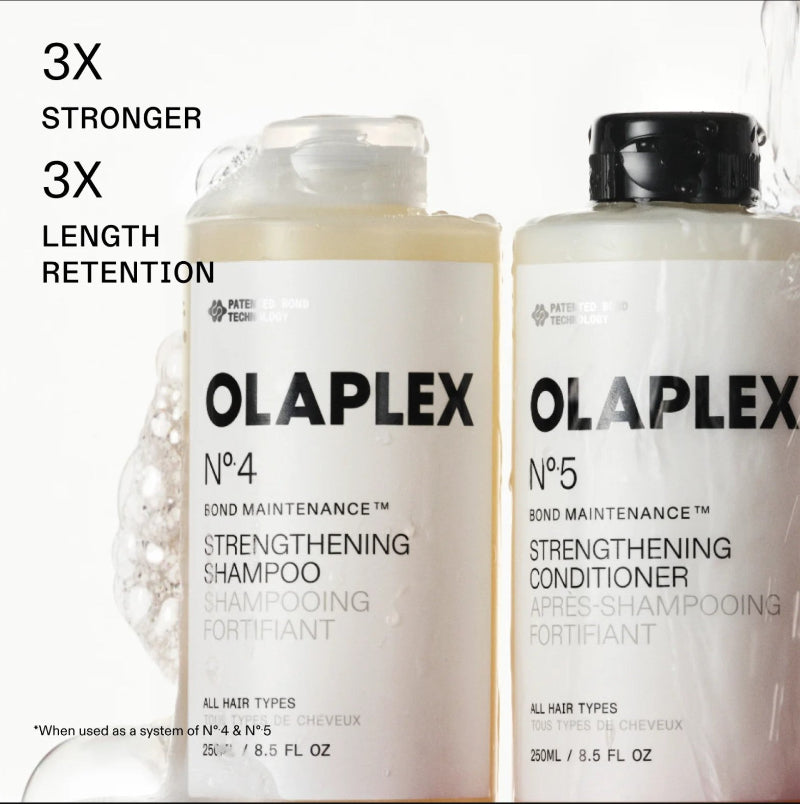 Two white bottles of OLAPLEX No.4 Bond Maintenance Strengthening Shampoo and No. 5 strengthening conditioner