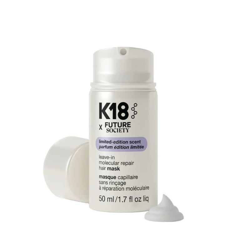 K18 Future X Leave-In Molecular Repair Hair Mask in a white cylindrical pump bottle, with the cap removed and lying on its side, and a small dollop of white mask on a clean white background.