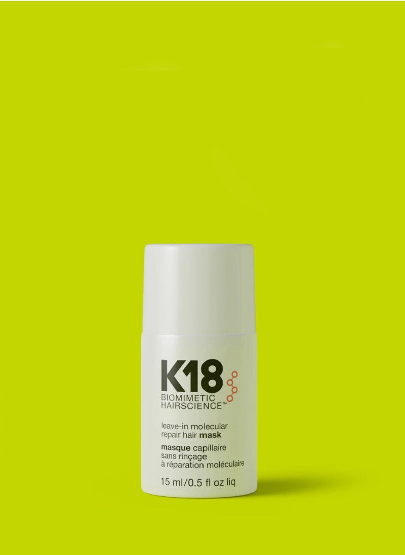 K18 Biomimetic Hairscience Leave-in Molecular Repair Hair Mask in a white cylindrical bottle with a white cap, set against a solid lime green background.