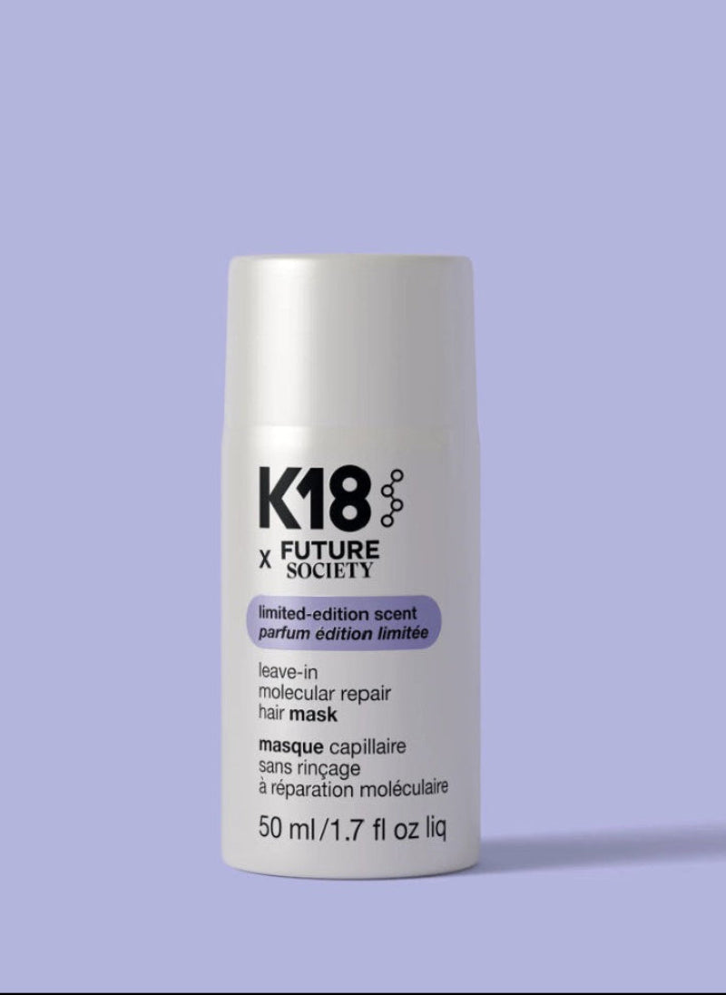 A white cylindrical bottle of K18 x Future Society leave-in molecular repair hair mask 50 ml, set against a solid lavender background.