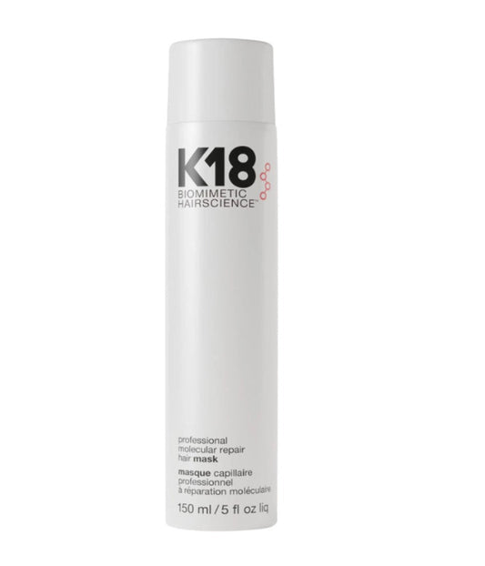 A white cylindrical bottle of K18 Biomimetic Hairscience hair mask on a plain white background.