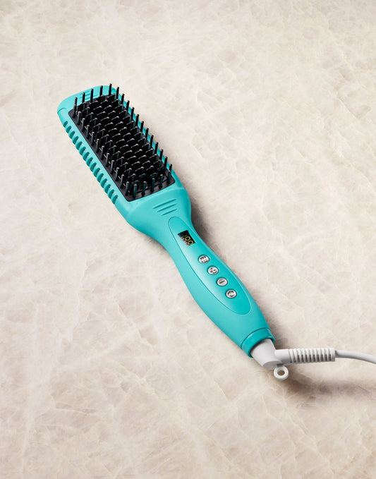 A Ceramc heated brush from Moroccanoil brand on a beige background