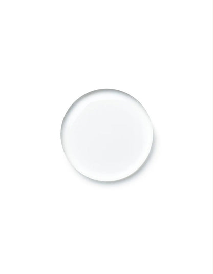 A single clear, round glass droplet or bubble centered on a solid white background.
