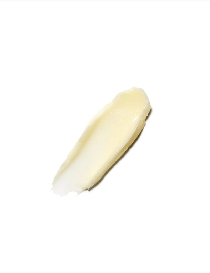 A thick, creamy swipe of Moroccanoil intense hydrating mask on a solid white background.
