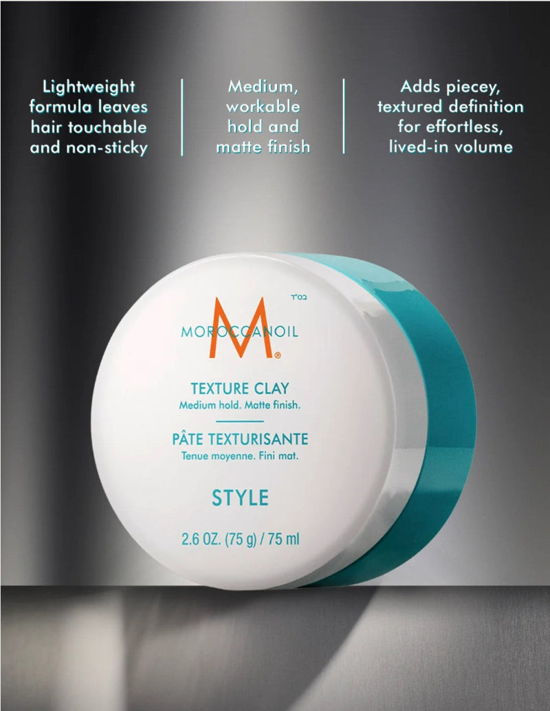 Moroccanoil Texture Clay Style hair styling product in a round white jar with a teal side band, shown on a dark gradient background with marketing text above.