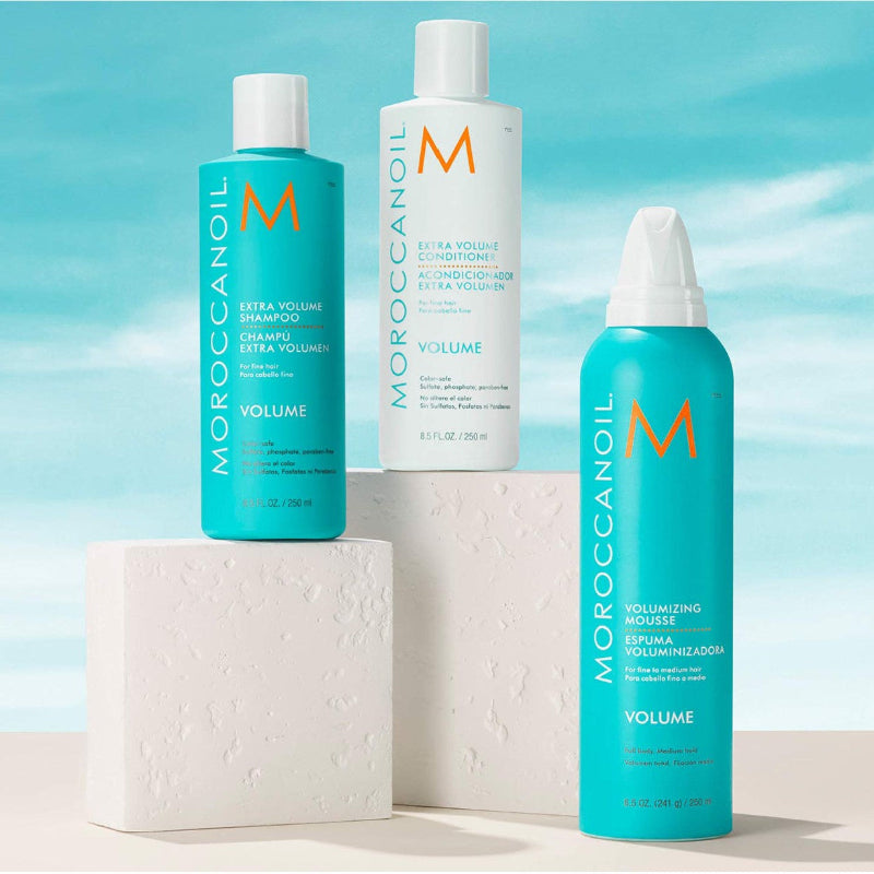 Moroccanoil hair products for extra volume hair showing a volumizing shampoo, conditioner and mousse