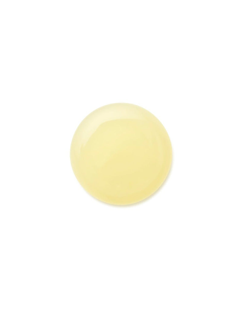 a drop of Moroccanoil oily scalp treatment on a white background
