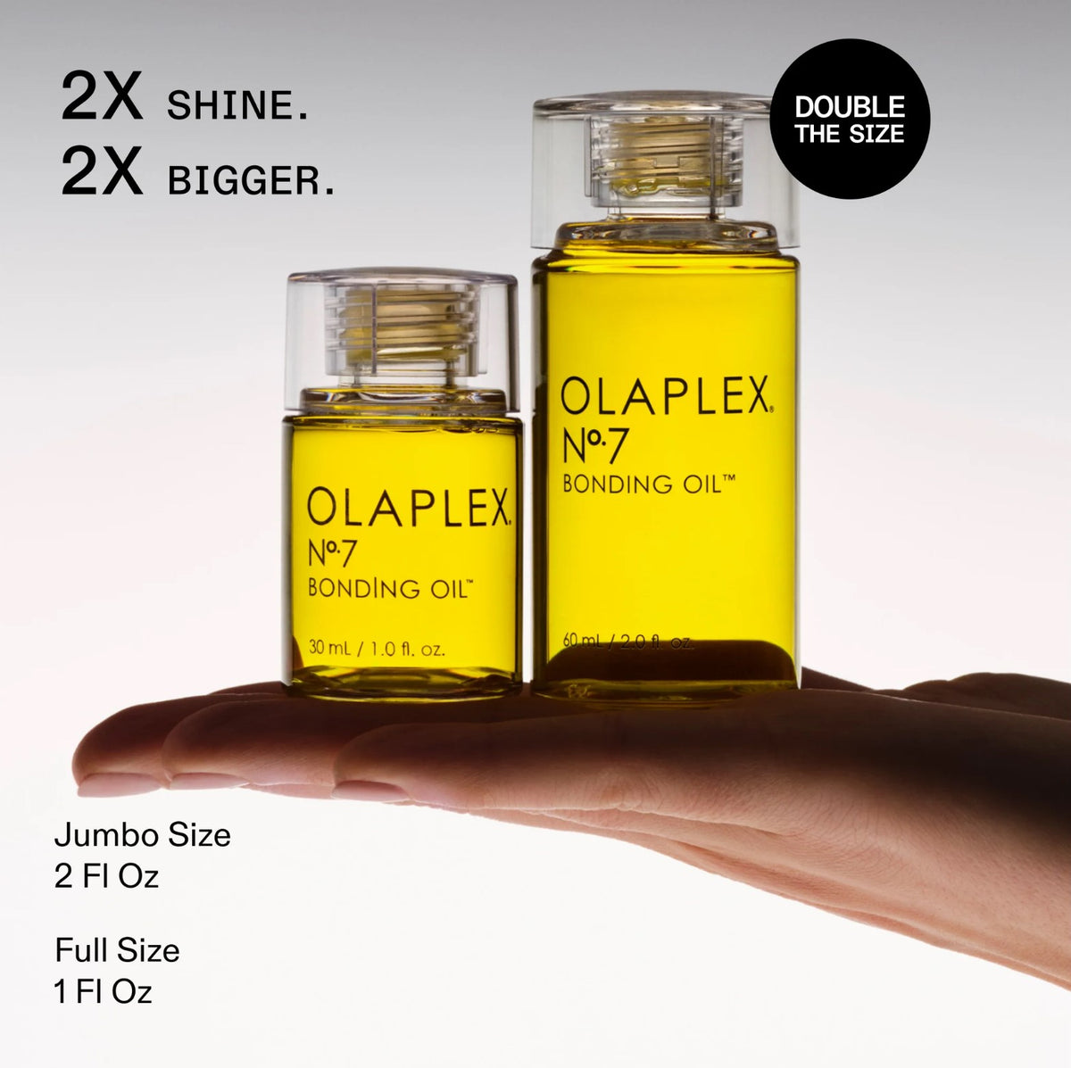 Two bottles of Olaplex No.7 Bonding Oil with text highlighting size comparison on a white background.
