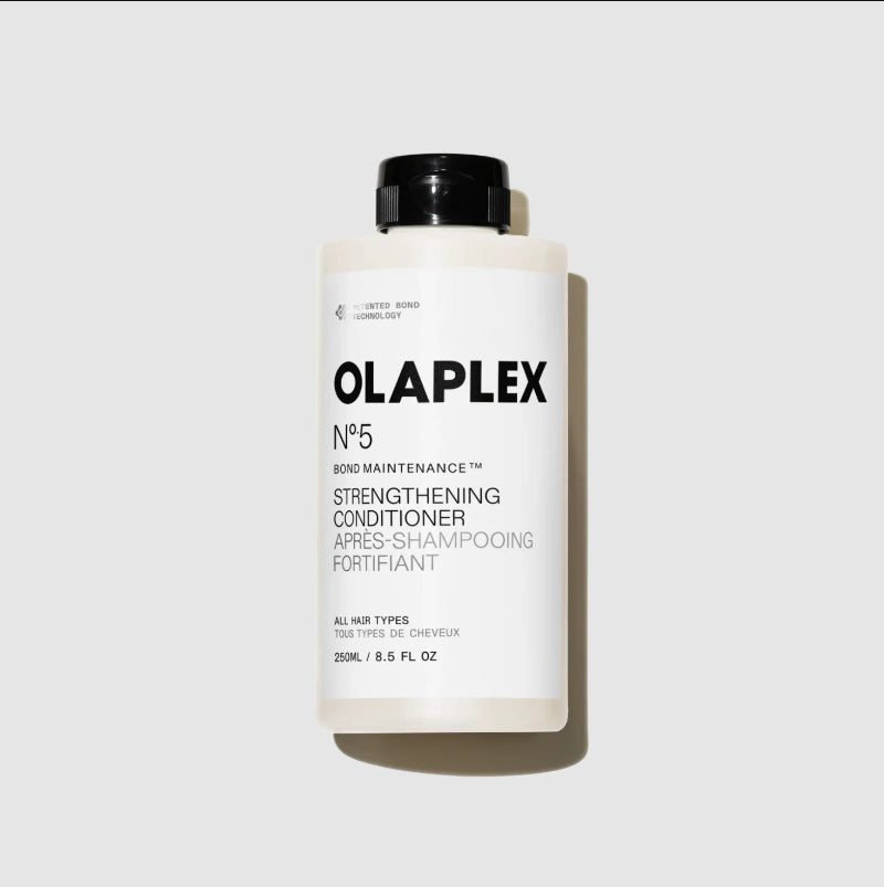 A 250ml bottle of Olaplex No.5 Bond Maintenance Strengthening Conditioner, featuring a white bottle with a black cap and black text, set against a light gray background with a soft shadow.