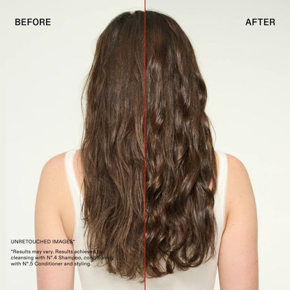 Before and after comparison of a woman's long, wavy brown hair, shown from the back against a plain light background. The left side is labeled BEFORE and appears frizzy or less defined, while the right side is labeled AFTER and looks smoother and shinier. She used Olaplex strengthening shampoo and conditioner