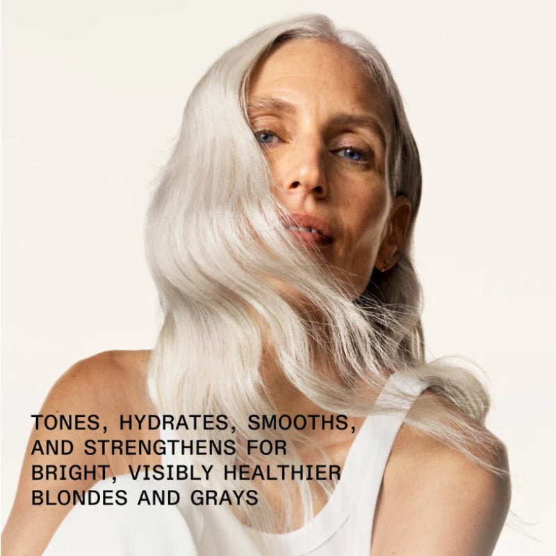 Woman with white silver blond hair against a white background with text about hair care to strengthen for healthier blondes and grays