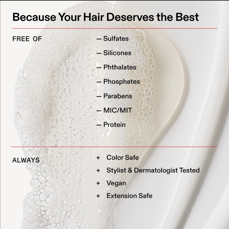 Promotional graphic for a hair care product with a close-up of lathered foam on a white container. Text reads 'Because Your Hair Deserves the Best' and lists benefits such as being free of sulfates, silicones, phthalates, phosphates, parabens, MIC/MIT, and protein, plus color safe, stylist and dermatologist tested, vegan, and extension safe. This product belongs to Olaplex volumizing shampoo.