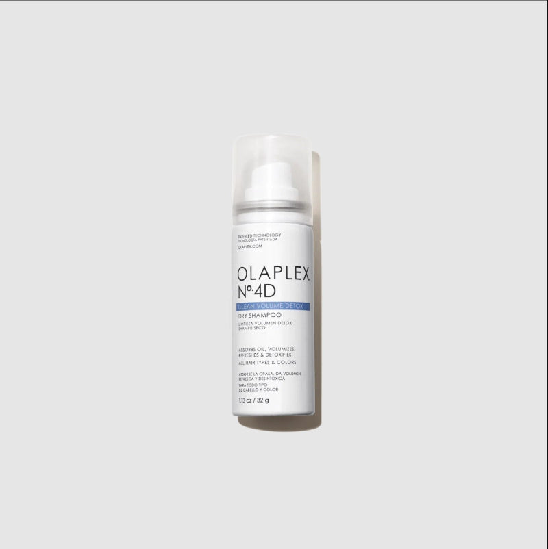 A mini travel bottle of Olaplex No.4D Light Shampoo with a clear cap, standing upright against a light gray background.