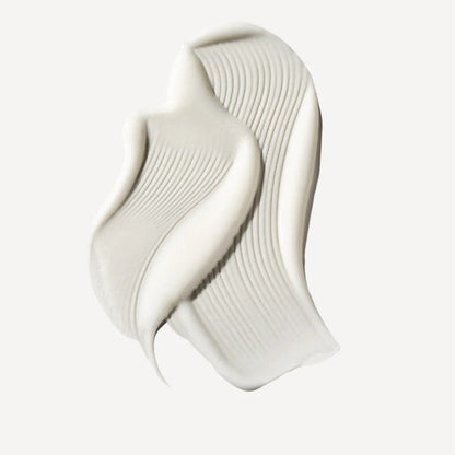 A thick, creamy off-white drop of Olaplex moisturizer and leave-in conditioner sample presented on a clean, light off-white background.