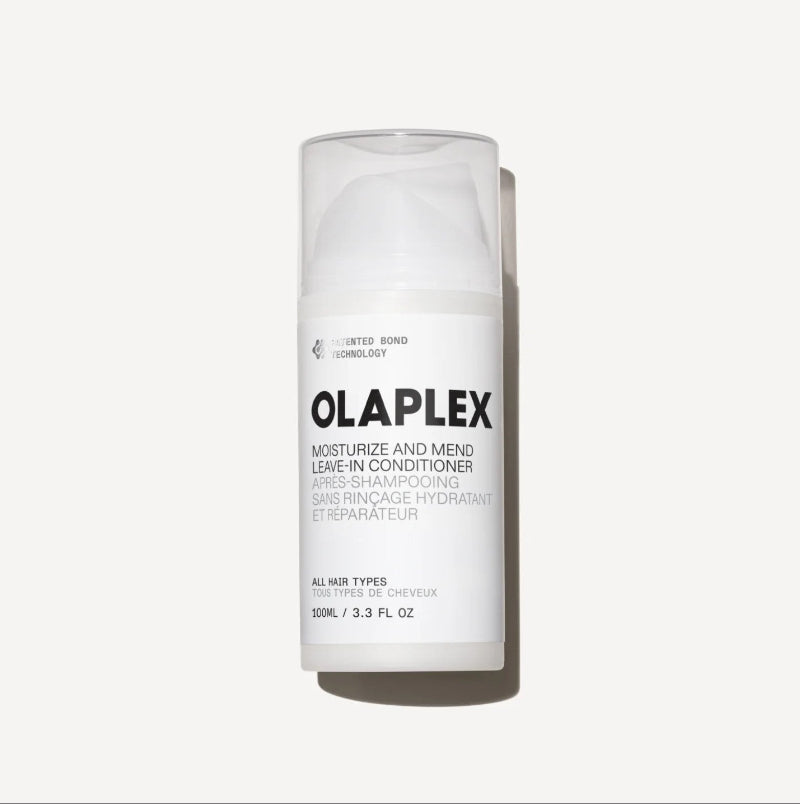A 100ml white bottle of Olaplex Moisturize and Mend Leave-In Conditioner, shown on a clean off-white background with a soft shadow.