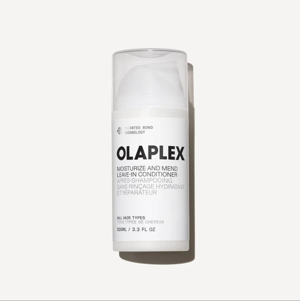 A 100ml white bottle of Olaplex Moisturize and Mend Leave-In Conditioner, shown on a clean off-white background with a soft shadow.