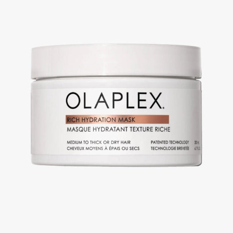 A white plastic jar of Olaplex Rich Hydration Mask with a white lid, featuring rich mask for medium to thick hair or dry hair