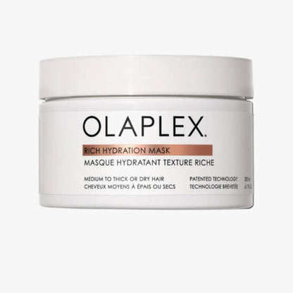 A white plastic jar of Olaplex Rich Hydration Mask with a white lid, featuring rich mask for medium to thick hair or dry hair