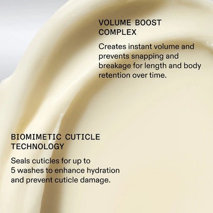 Close-up of a creamy texture with text about volume boost complex and biomimetic cuticle technology with Olaplex nourishing hair mask
