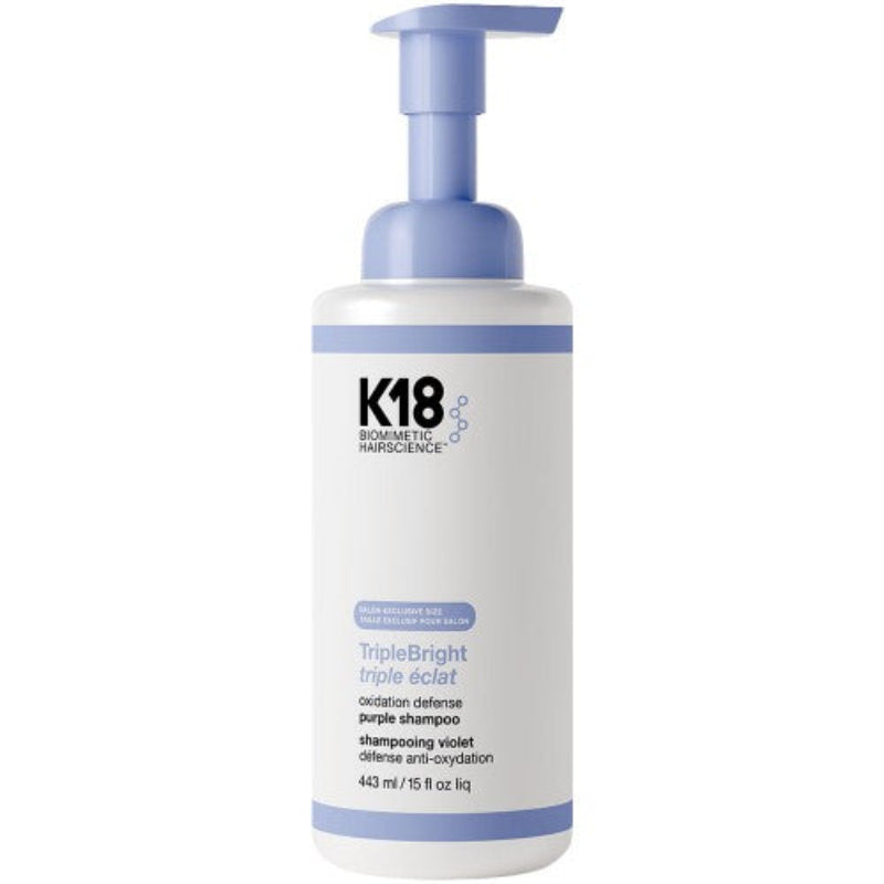 K18 hair care product bottle with pump on a white background