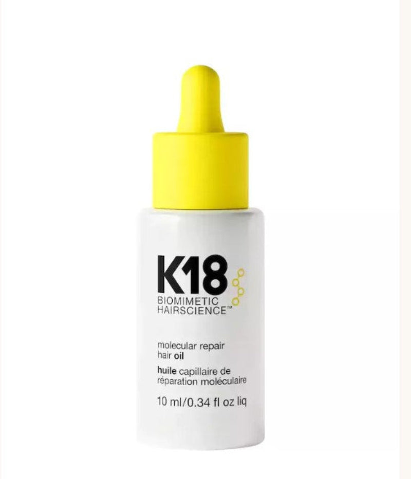 K18 Biometric Hairscience Molecular Repair Hair Oil 10 ml in a white bottle with a bright yellow dropper cap, shown on a white background.