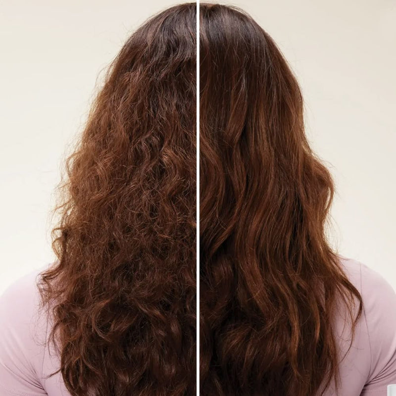 Rich, velvety texture of Olaplex No. 6 leave-in treatment cream on fingertips